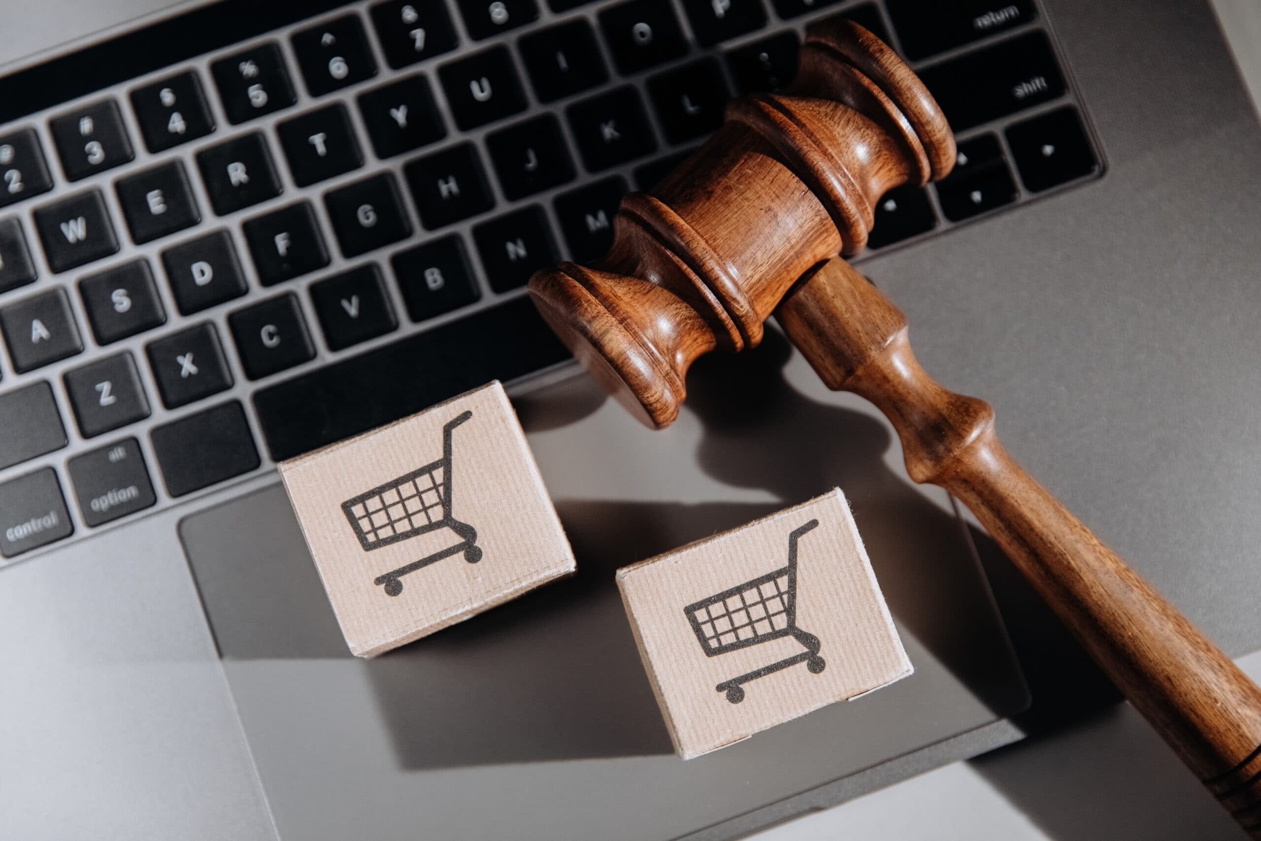 judge-gavel-card-boxesx-laptop-consumer-law-concept-scaled.jpg